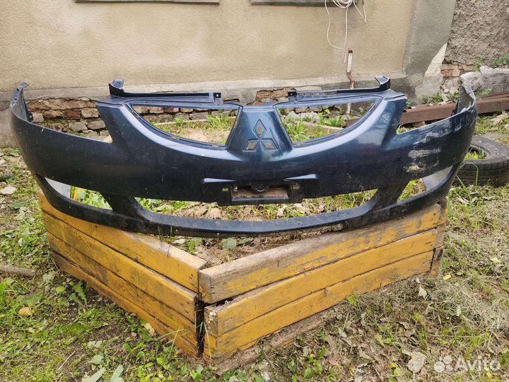 Бампер передний до рестайл на mitsubishi lancer 9
