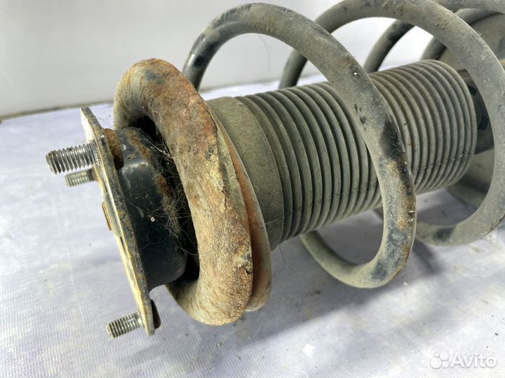 Стойка амортизатора передняя Nissan Wingroad Y11