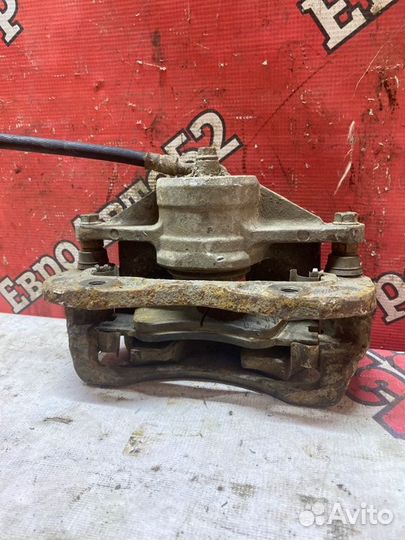 Суппорт тормозной передний левый Kia Sorento 1 EX