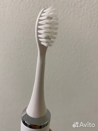 Электрическая зубная щетка