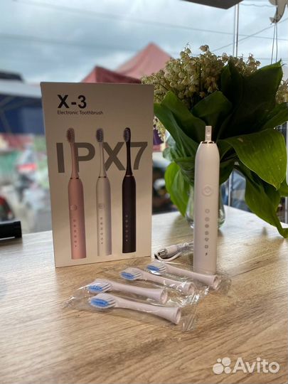 Электрическая зубная щетка