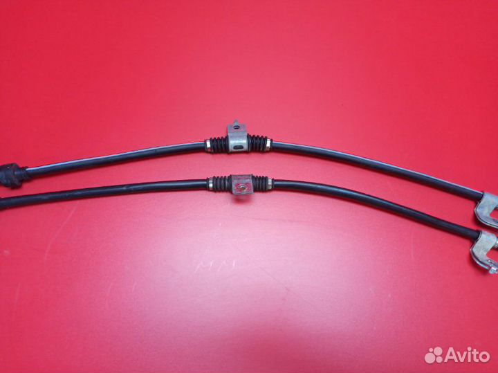 Трос стояночного тормоза задний Mitsubishi Lancer