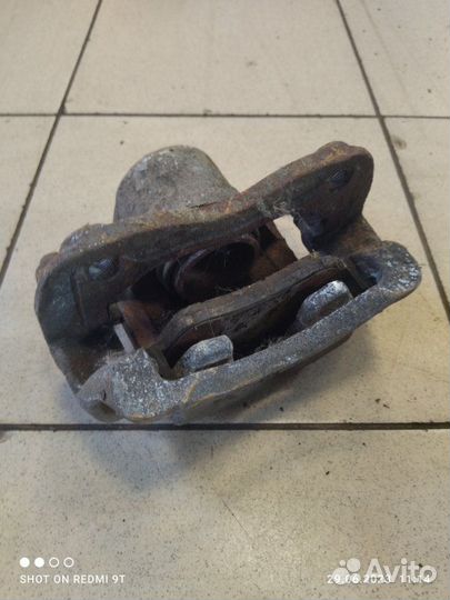 Суппорт тормозной передний левый Kia Rio 4