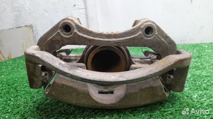 Суппорт передний левый Nissan Almera Classic 1.6