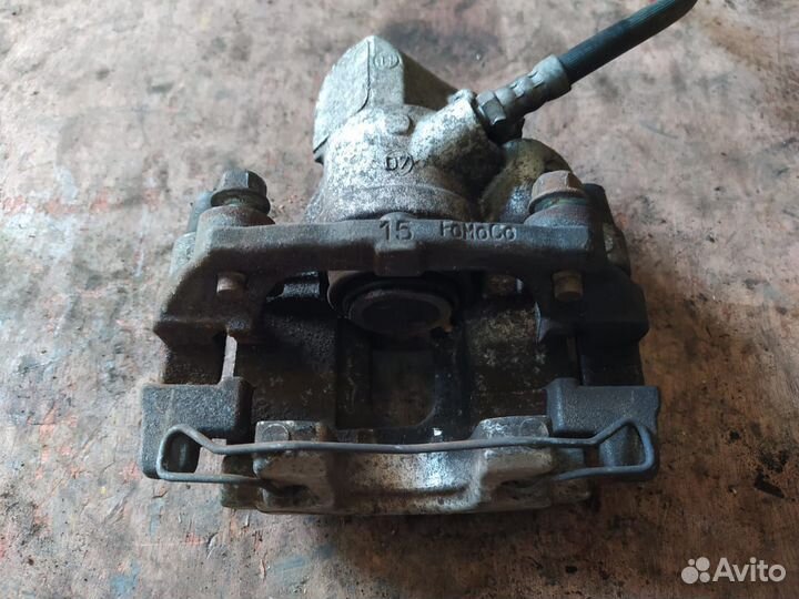 Суппорт задний Мазда 3 бл Mazda 3 BL