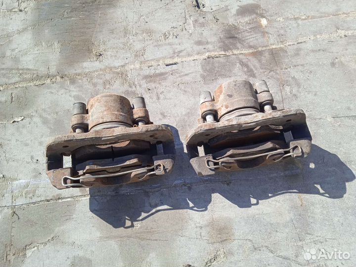 Суппорт передний левый Киа Шума 1