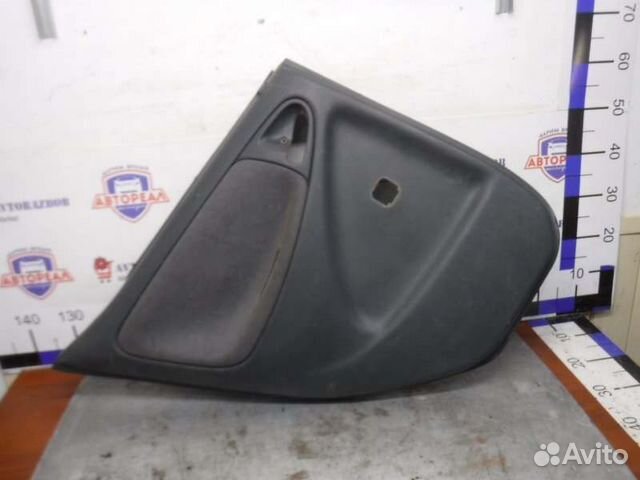 Обшивка двери задняя левая Toyota Vitz 1szfe 1999