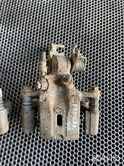 Суппорт задний Nissan Primera P11