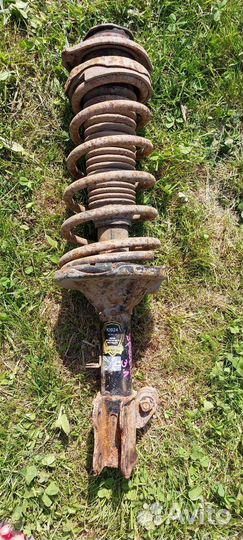 Стойка амортизатора задняя левая Kia Spectra