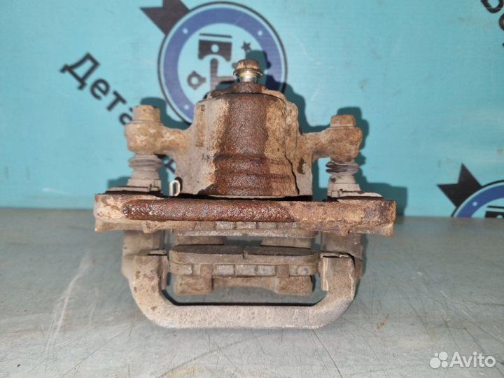 Суппорт тормозной задний правый Nissan Qashqai J10