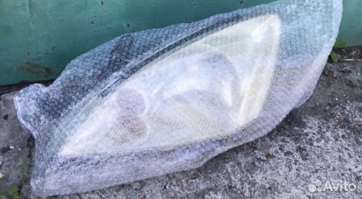 Фара левая lancer 9