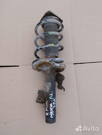 Передняя левая стойка Mazda Axela 1 Седан