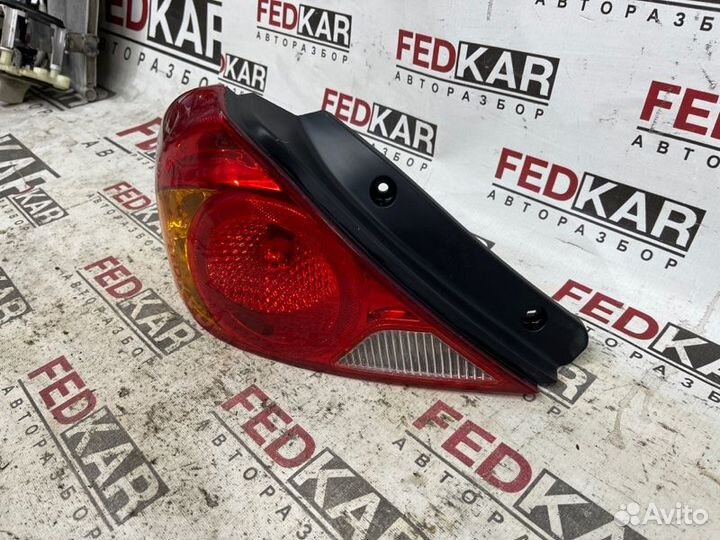 Фонарь задний левый задний левый Kia Spectra SD
