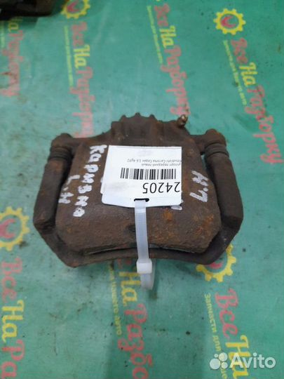 Суппорт передний левый Mitsubishi Carisma седан