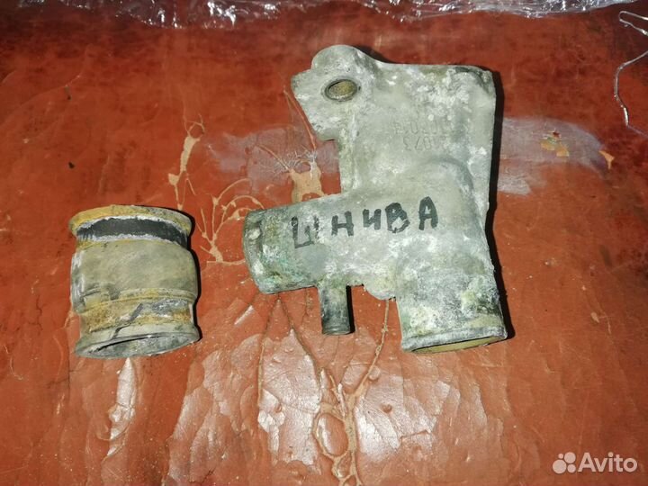 Патрубок отводящий Нива Шевроле