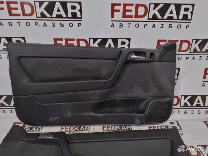 Обшивка боковой двери передняя левая Opel Astra G