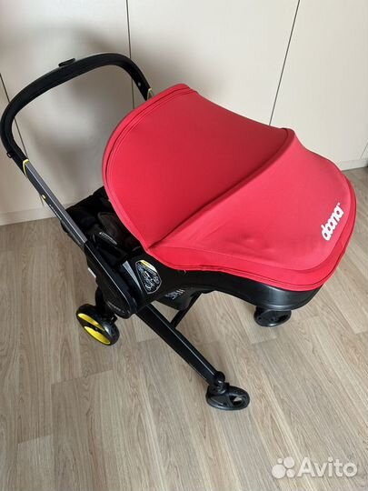 Автолюлька на колесах doona с базой