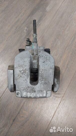 Суппорт тормозной задний левый Bmw X5 4.8I E70