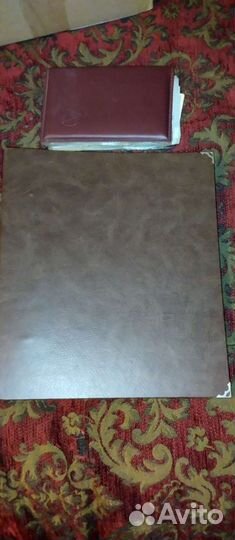 Два альбома с монетами разных времён и эпох