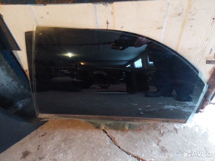 Стекло задней левой двери Kia Spectra