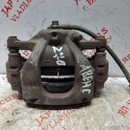 Суппорт тормозной передний левый Toyota Avensis