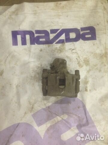 Суппорт тормозной задний правый Мазда 3