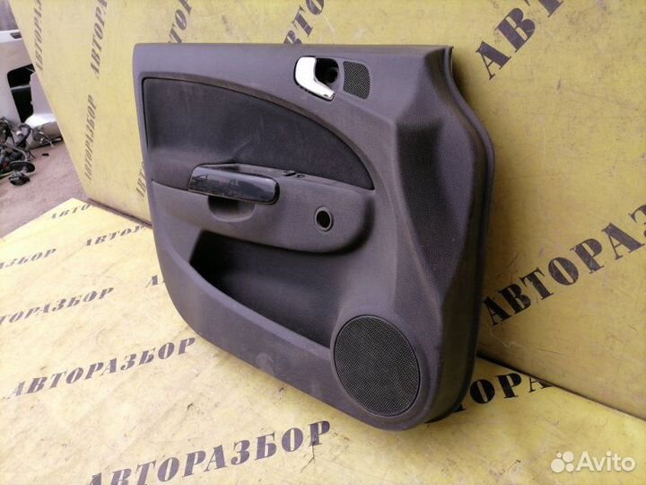 Обшивка двери передней левой Opel Corsa D