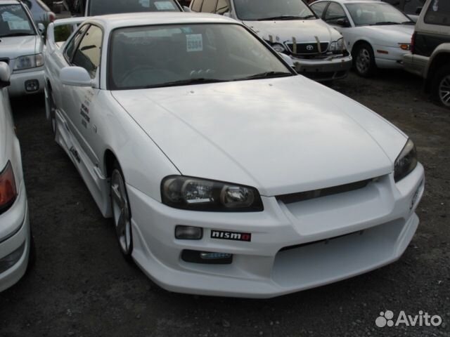 Передний бампер C-West на Nissan Skyline R34