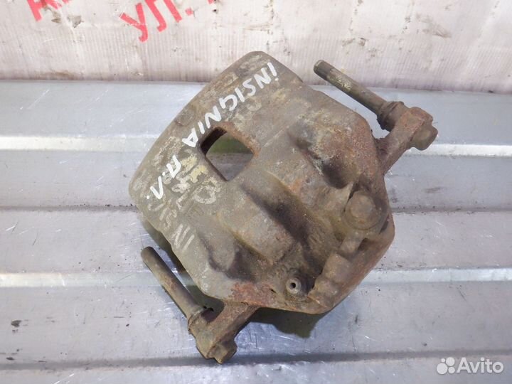 Суппорт тормозной передний левый Опель Инсигния