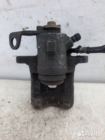 Суппорт тормозной задний левый Volkswagen Golf