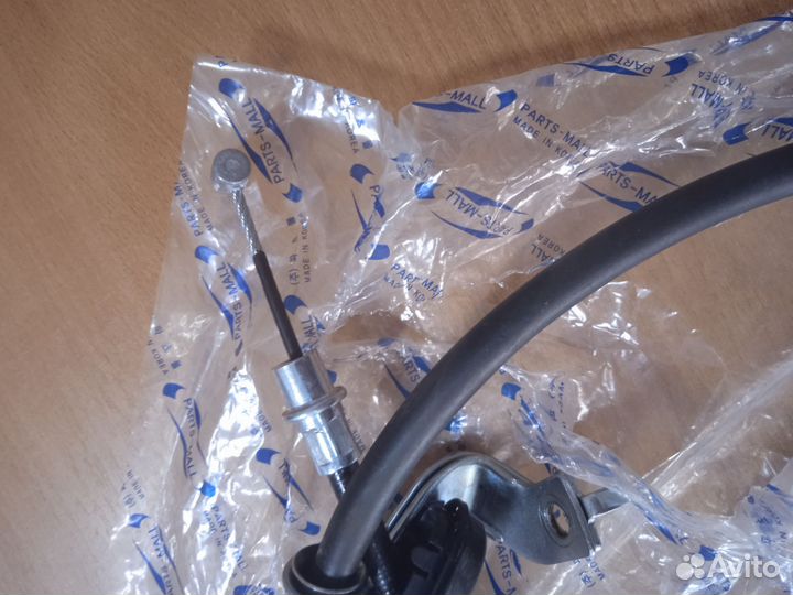 Трос ручника левый Киа Спортаж 2 дорест 2WD