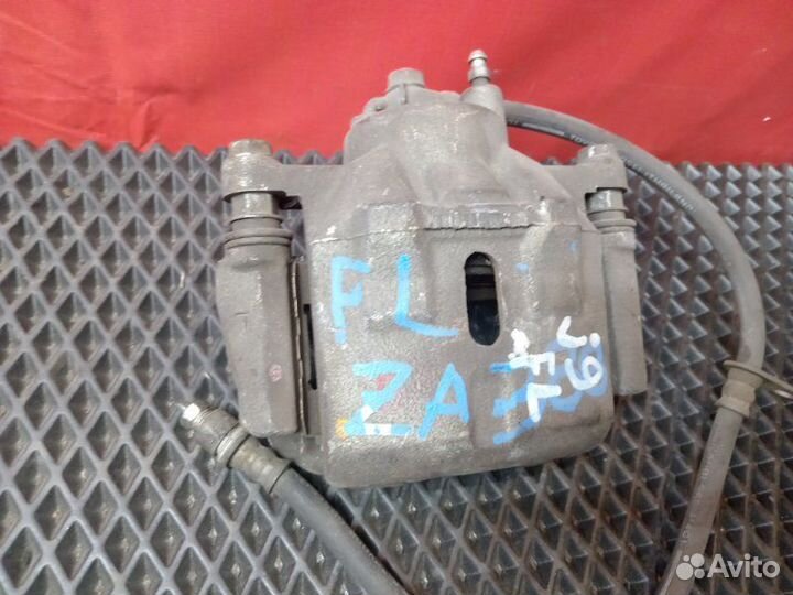 Суппорт передний левый Toyota Probox NCP51V 1NZ-FE