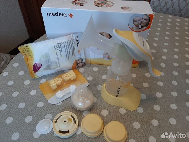 Молокоотсос Medela+соска Calma +Набор клапанов