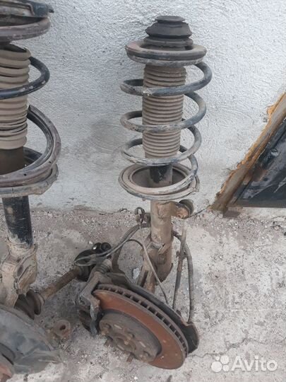 Стойки амортизаторы Geely Emgrand