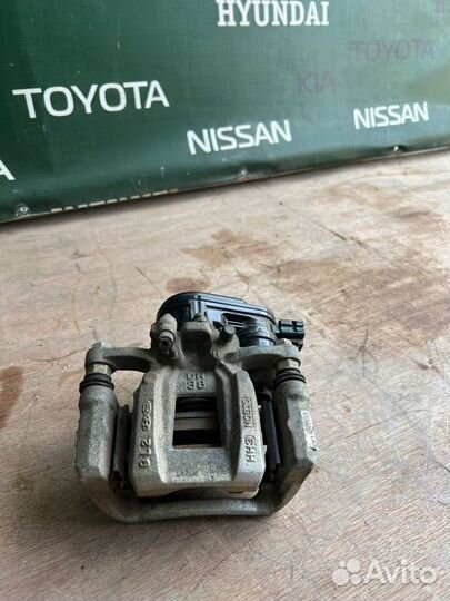 Суппорт тормозной задний правый Kia K5 DL3 G4NA