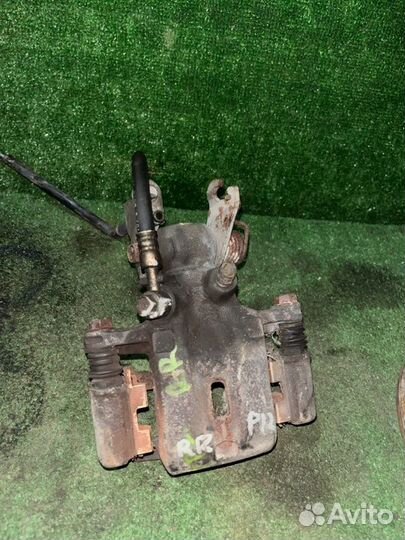 Суппорт тормозной задний правый Nissan Primera