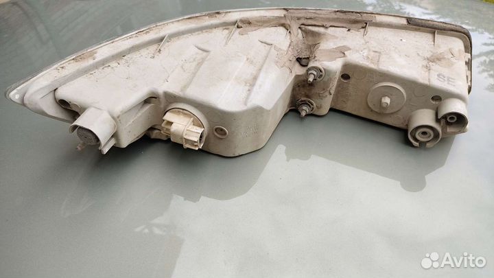 Поворотник левый Nissan Almera Classic