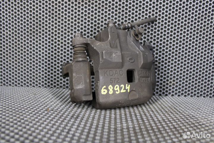 Суппорт тормозной передний левый Nissan Teana J31