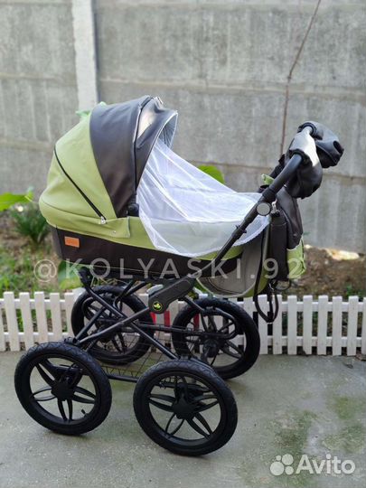 Коляска из эко кожи 2 в 1