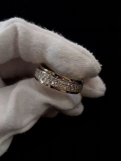 Золотое кольцо с пожвижным центром и бриллиантами